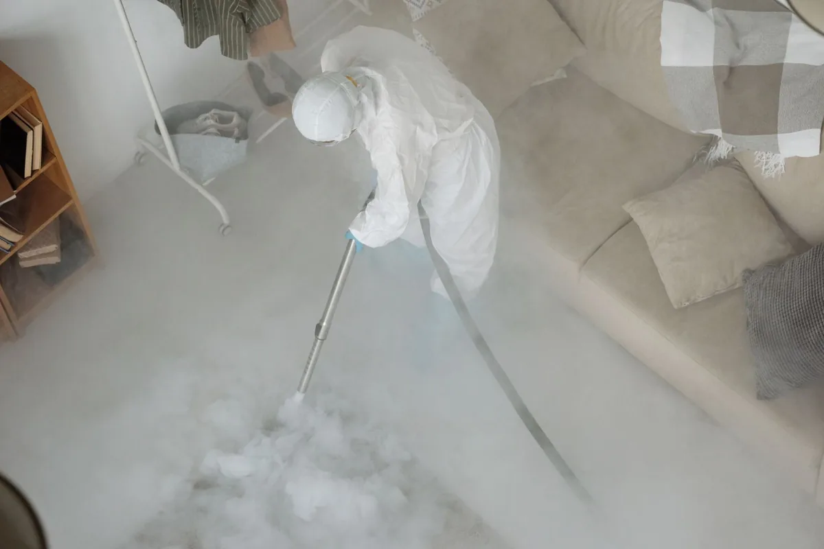 Biohazard cleanup technician in protective equipment, Machias, WA